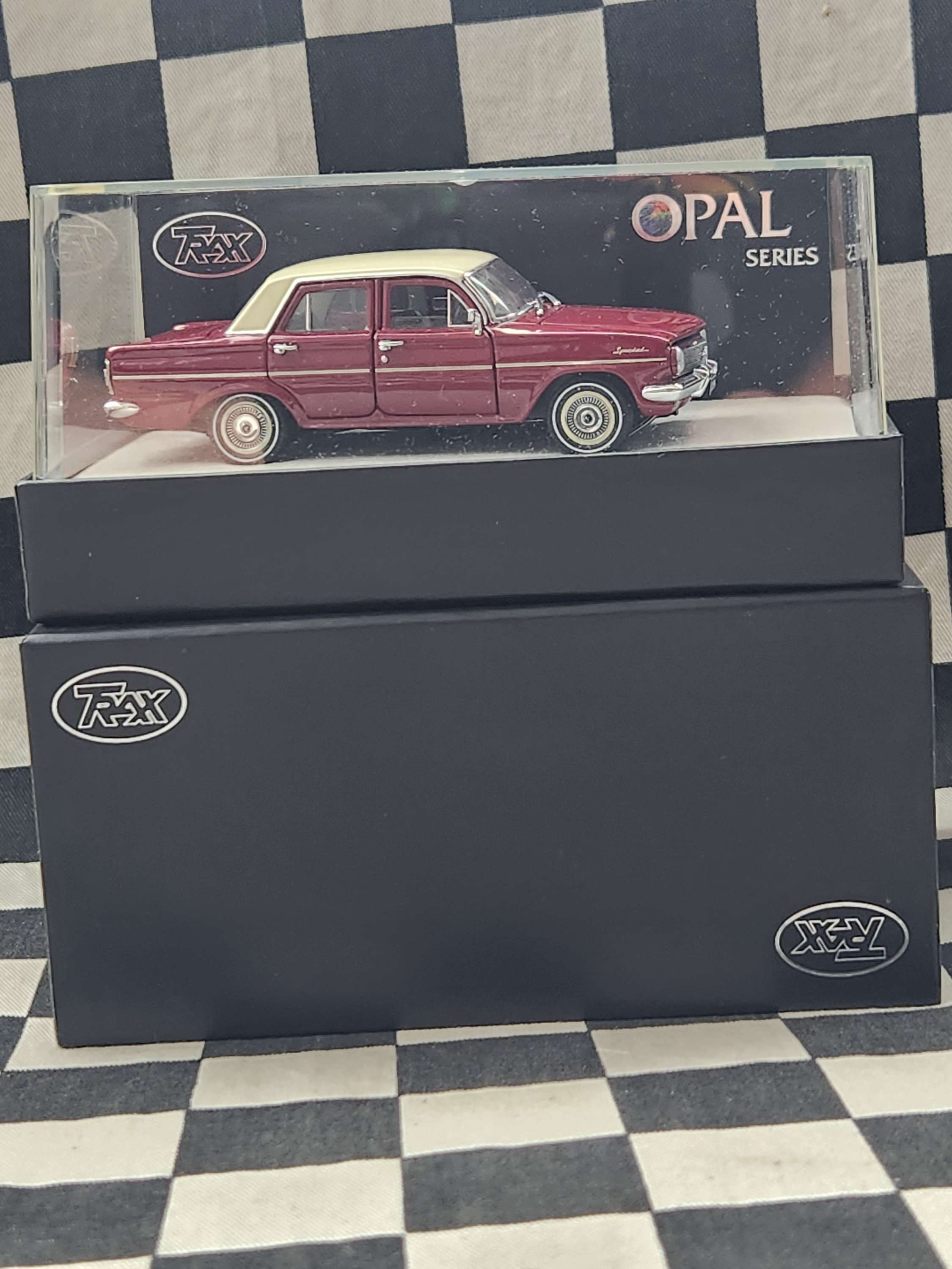 Trax 1:43 Opal Series EH Holden Sedan Winton Red / Fowlers Ivory Roof